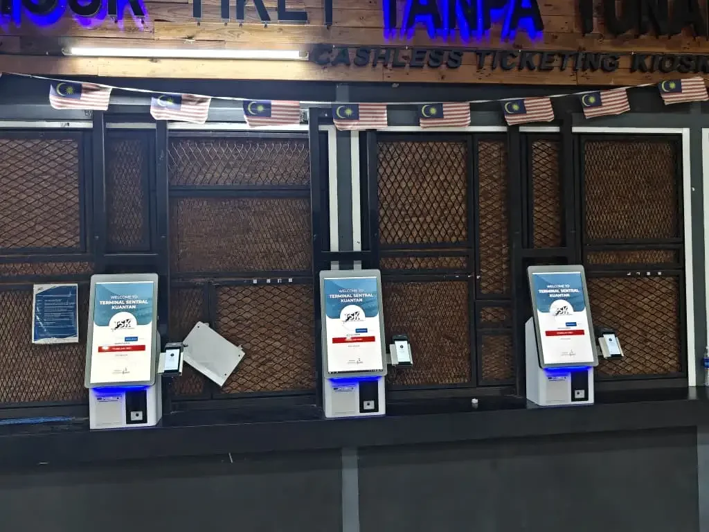 CRTLY B Series desktop self-service bus ticket kiosks installed at a bus terminal in Malaysia
